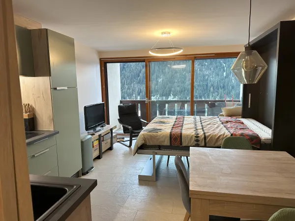 Couchage 2 personnes dans pièce à vivre
